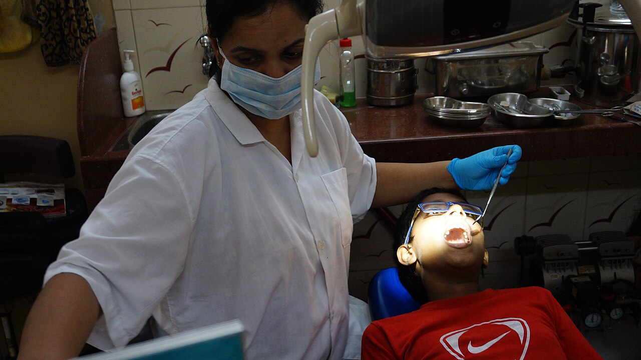Dentist treating a young patient